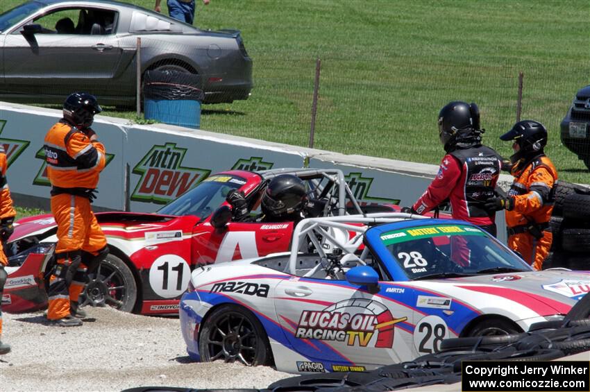 Robert Stout's and Ara Malkhassian's Mazda MX-5 Cups crash out at turn 7.