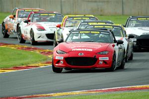 Gresham Wagner's Mazda MX-5 Cup leads a pack of seven cars.
