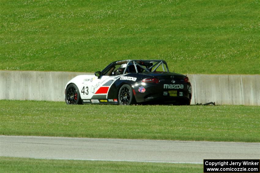 Brian Lockwood's Mazda MX-5 Cup parks it just after turn 3.