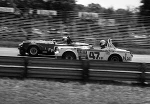 (47) Bob Hubbard's MG Midget races (80) Martin 'John' Stoesser's Triumph Spitfire for the FP win.