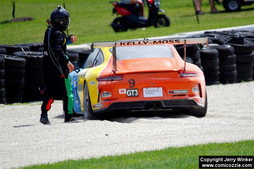 Tom Balames' Porsche GT3 Cup is stuck in the gravel trap at turn 14 on the final lap.
