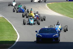 The pace car brings the field through the carousel.