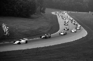 The field comes through turns six and seven on the pace lap.