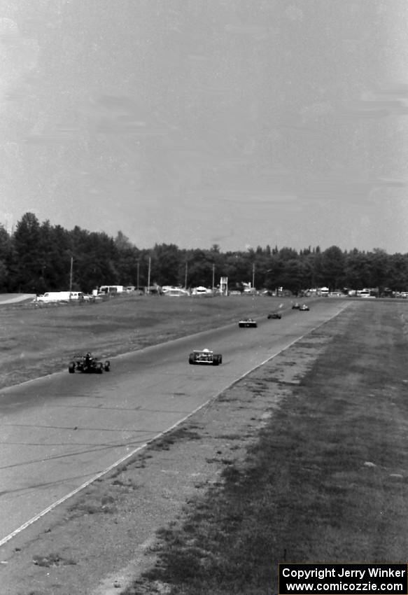 Race group 6 cars out qualifying fly down the Kinnard Straight.