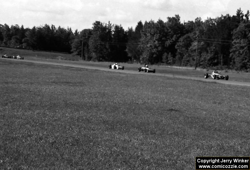 Formula Fords fly down the Kinnard Straight early in the race.