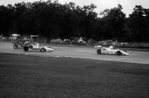 Bobby Unser, Jr.'s Ralt RT-5/80 heads to the pits while being chased by Arie Luyendyk's March 81V and Pete Halsmer's Ralt RT-5