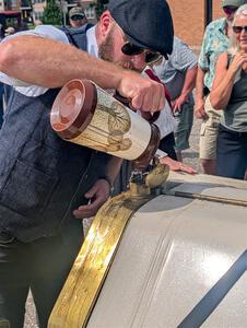 Wade Donley / Jenny Donley 1908 Overland stops for water in Anoka, MN.