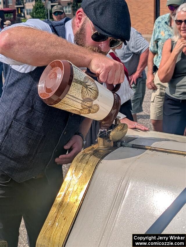 Wade Donley / Jenny Donley 1908 Overland stops for water in Anoka, MN.