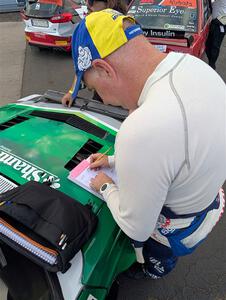 Gary McElhinney goes over his pace notes at parc expose at Soo Pass Ranch.