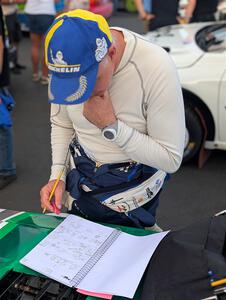 Gary McElhinney goes over his pace notes at parc expose at Soo Pass Ranch.