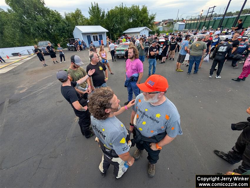 Richard Donovan and Greg Donovan converse at parc expose at Soo Pass Ranch.
