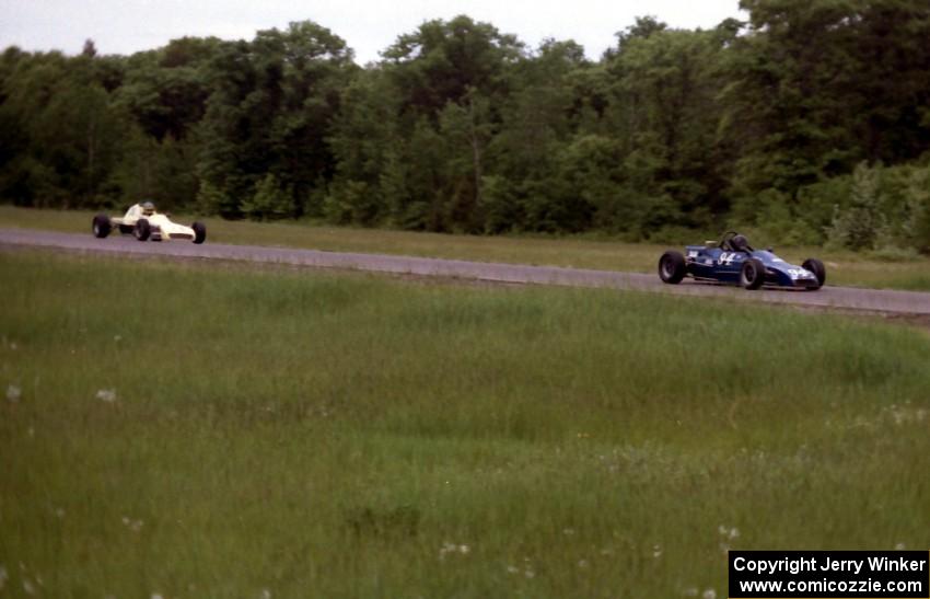 Paul Petit's Lola T-540 leads Gene Anderson's Crossle 35F into turn 3 during Formula Ford practice.