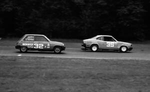 Chuck Ulinski's Mazda RX-3 leads Bobby Archer's Renault LeCar