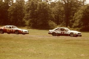 Vern Smith's Mercury Capri ahead of Patty Moise's Chevy Camaro