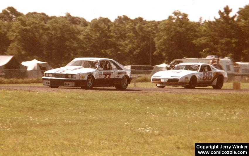 Vern Smith's Mercury Capri leads Irv Hoerr's Pontiac Firebird