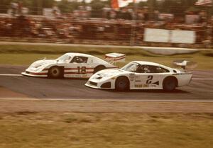 The pass for the lead. John Paul, Jr. and John Fitzpatrick, both in Porsche 935s.