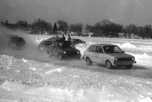 Len Jackson's Ford Fiesta and Todd Larson's Renault LeCar lead a small pack near the start of the race.