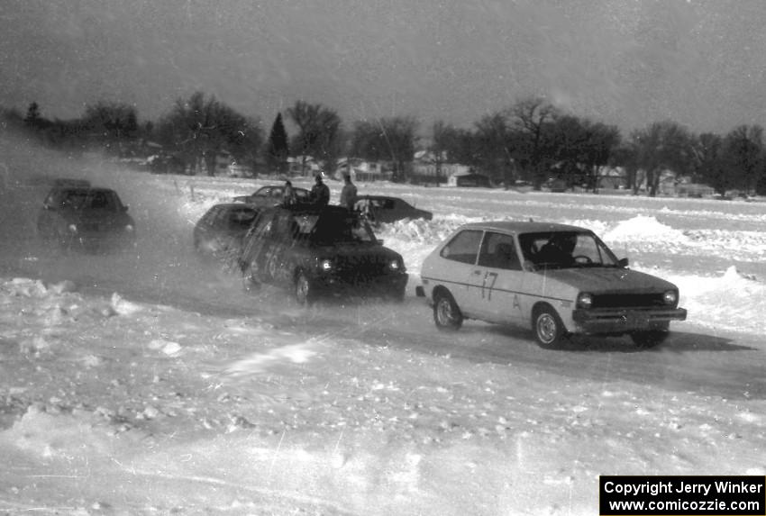 Len Jackson's Ford Fiesta and Todd Larson's Renault LeCar lead a small pack near the start of the race.