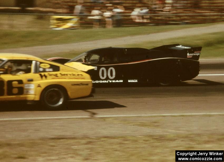 Ted Field's Lola T-600/Chevy passes Jack Buchinger's Datsun 280ZX down the front straight.