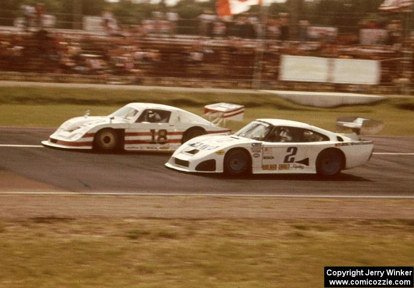 The pass for the lead. John Paul, Jr. and John Fitzpatrick, both in Porsche 935s.