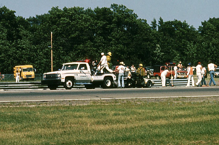 Diego Montoya's BMW M-1 is taken off the front straight after a hard impact to the rear.