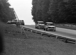 Karl Hacker leads Paul Hacker and others into turn 5.