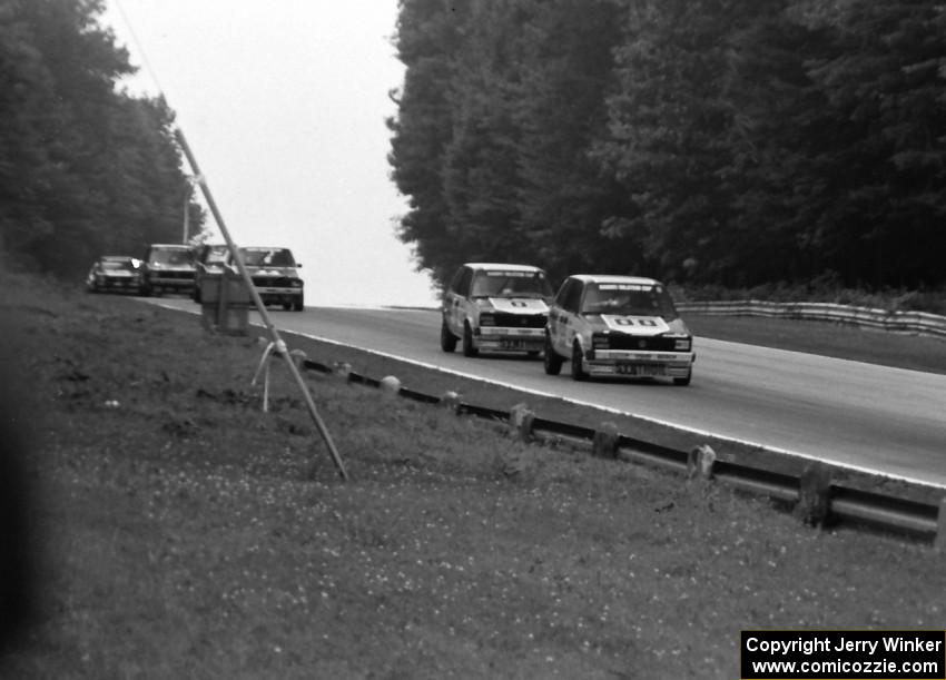 Karl Hacker leads Paul Hacker and others into turn 5.