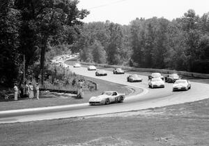 Jerry Hansen's Chevy Corvette leads the field through turn 12 on the pace lap.