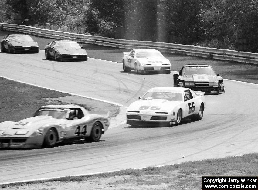 The leaders come into Canada Corner, turn 12.