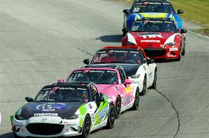 Five Mazda MX-5 Cup cars head into turn 7 during race 1.