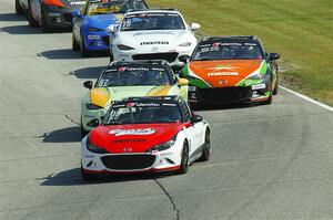 Five Mazda MX-5 Cup cars head into turn 7 during race 1.