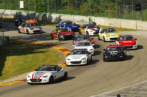 The MX-5 Cup field heads through Canada Corner on the pace lap.