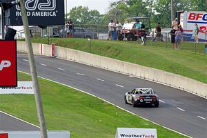 Joey Rainey's Mazda MX-5 Cup dives into the pits.