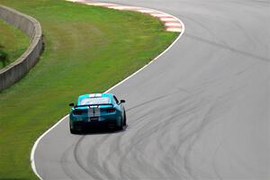 Scott Thomson's Ford Mustang Dark Horse R limps through Thunder Valley on the pace lap of race 2.