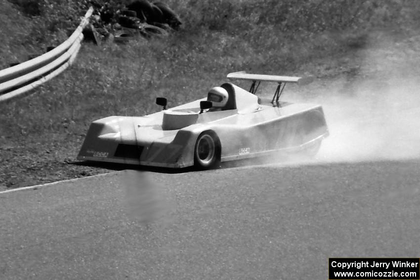 Jerry Booker's Brabham BT C-Sports Racer loses its engine.