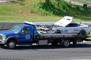 Mitch Marvosh's Ford Mustang Dark Horse R comes by on the flatbed.