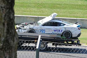 Mitch Marvosh's Ford Mustang Dark Horse R comes by on the flatbed.
