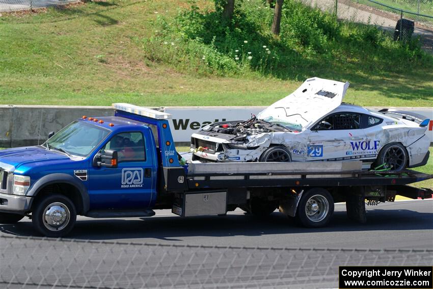 Mitch Marvosh's Ford Mustang Dark Horse R comes by on the flatbed.