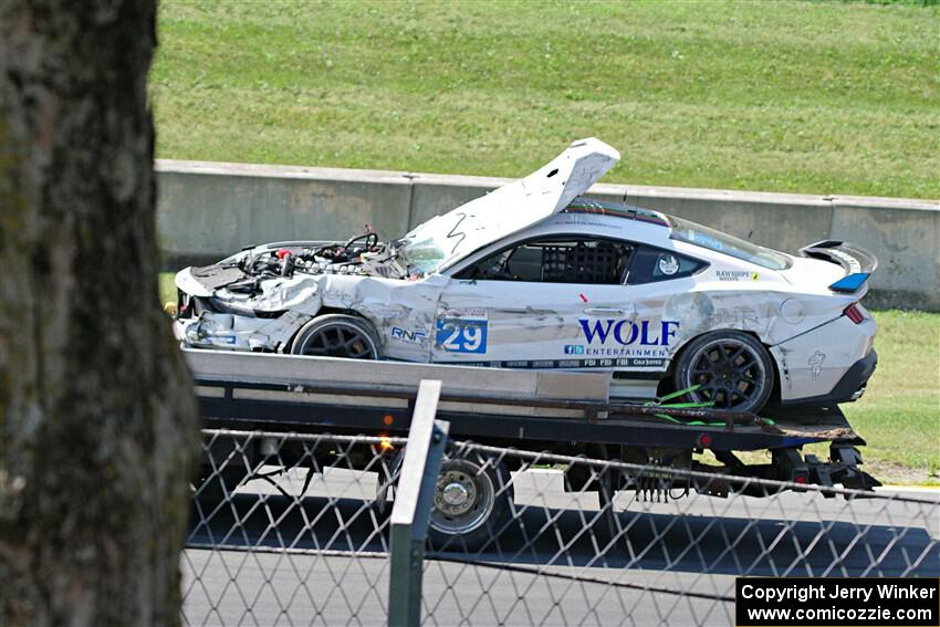 Mitch Marvosh's Ford Mustang Dark Horse R comes by on the flatbed.
