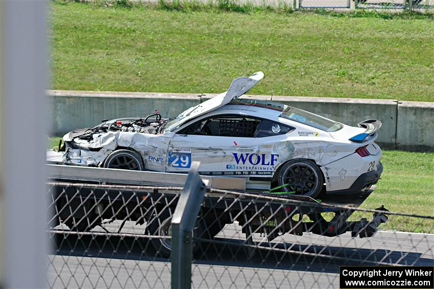 Mitch Marvosh's Ford Mustang Dark Horse R comes by on the flatbed.