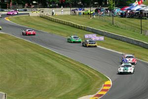 Porsche GT3 Cups stream into the Hurry Downs on lap one of race 1.