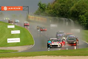 The field streams down into turn 3 on the restart.
