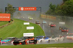 The field streams down into turn 3 on the restart.