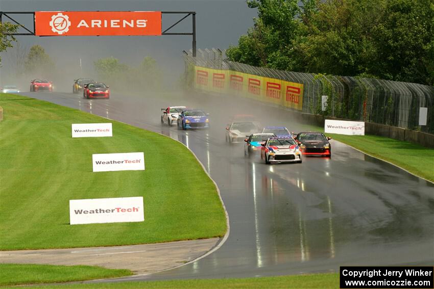 The field streams down into turn 3 on the restart.