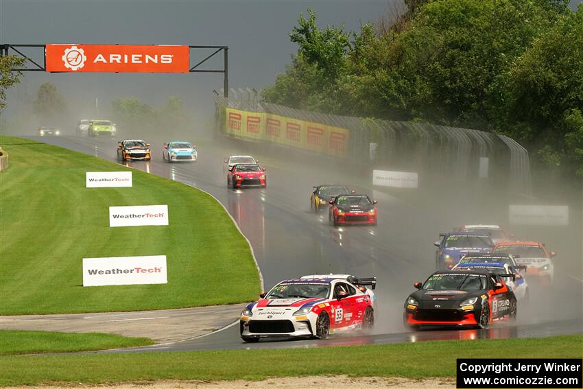 The field streams down into turn 3 on the restart.