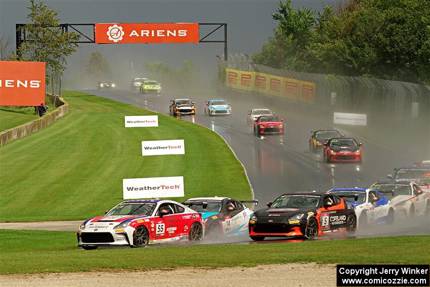 The field streams down into turn 3 on the restart.