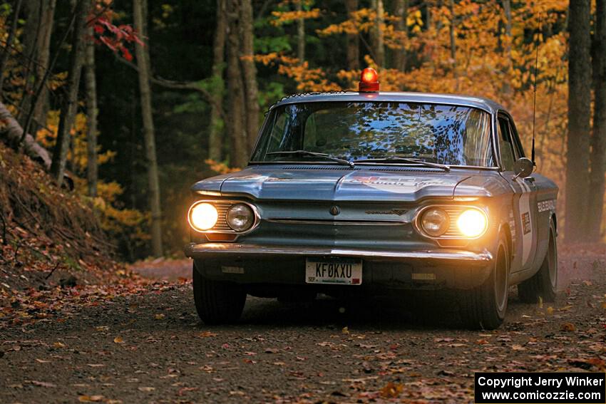 Tyler Linner's Chevy Corvair checks the course as Stage Captain on SS15, Mount Marquette.