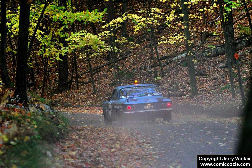 Tyler Linner's Chevy Corvair checks the course as Stage Captain on SS15, Mount Marquette.