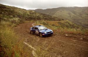 The Shane Mitchell / Paul Donnelly Subaru WRX slows down for a hairpin on Del Sur 1.