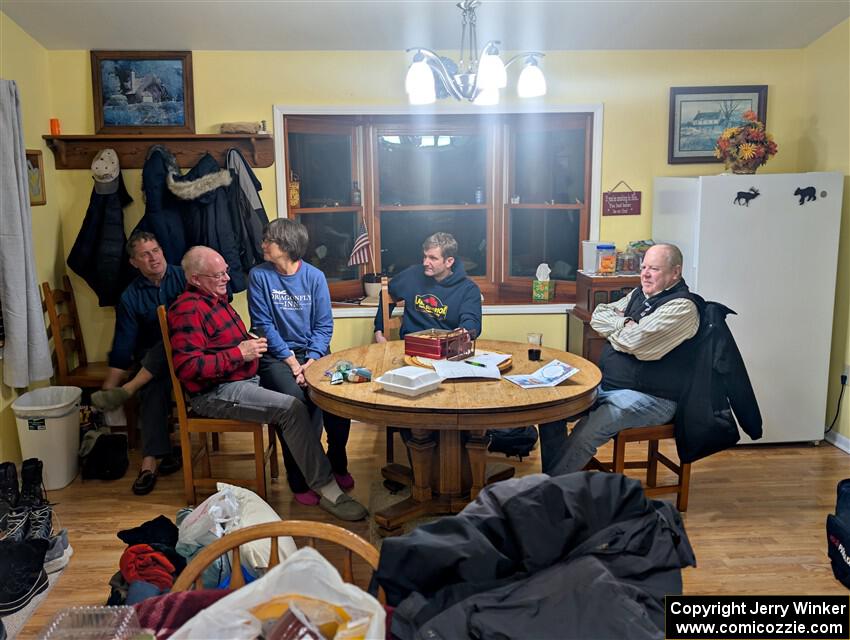 Enjoying snacks and trading rally stories at the rental house.